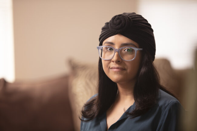 Aracely poses for a portrait at her home in Illinois
