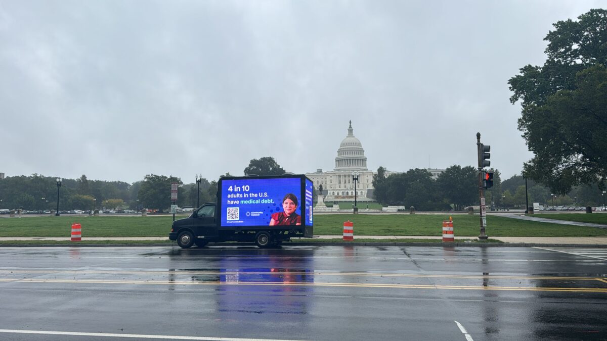 A mobile billboard that reads "4 in 10 adults in the U.S. have medical debt" is parked in front of Capitol Hill in Washington, D.C.