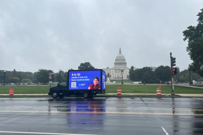 A mobile billboard that reads "4 in 10 adults in the U.S. have medical debt" is parked in front of Capitol Hill in Washington, D.C.