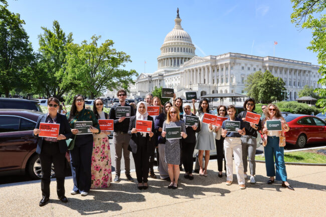 Members of Community Catalyst pose for a photo on the Medical Debt Day of Action on Capitol Hill in Washington, D.C.
