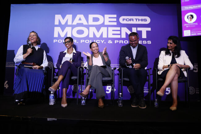 Five panelists sit in front of a purple sign that says "Made for this moment. Power, Policy, & Progress."
