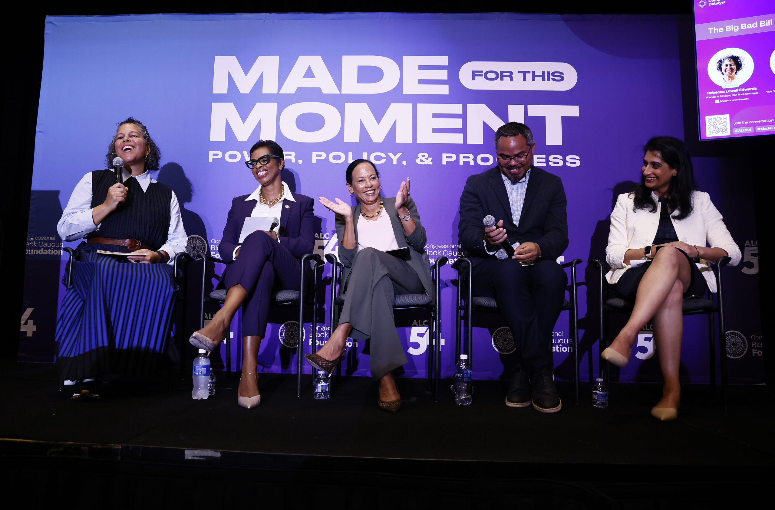 Five panelists sit in front of a purple sign that says "Made for this moment. Power, Policy, & Progress."